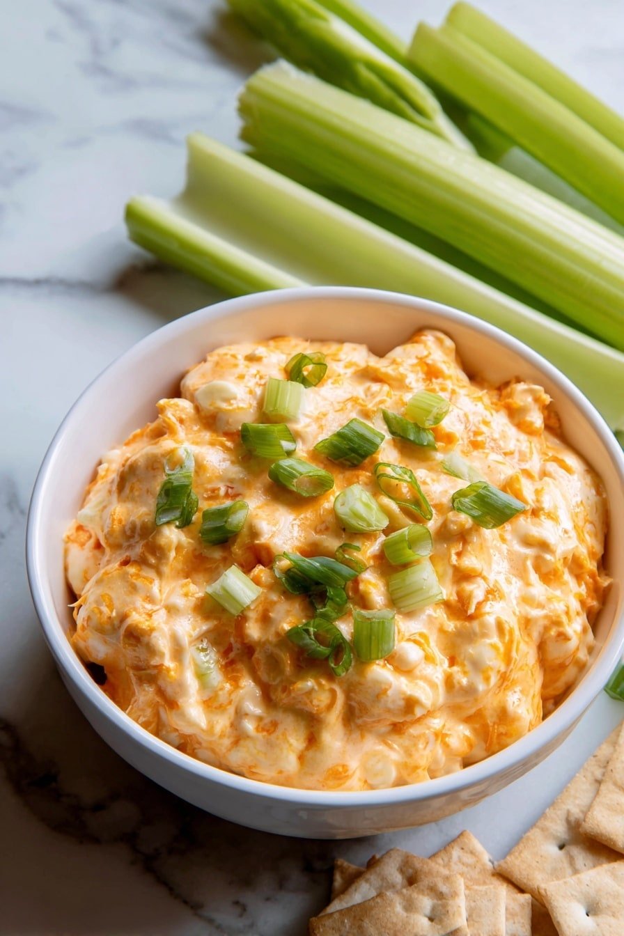 Buffalo Chicken Dip Recipe - Article Image 1 — Buffalo Chicken Dip, spicy buffalo chicken dip, creamy chicken appetizer, game day dip, easy party dip