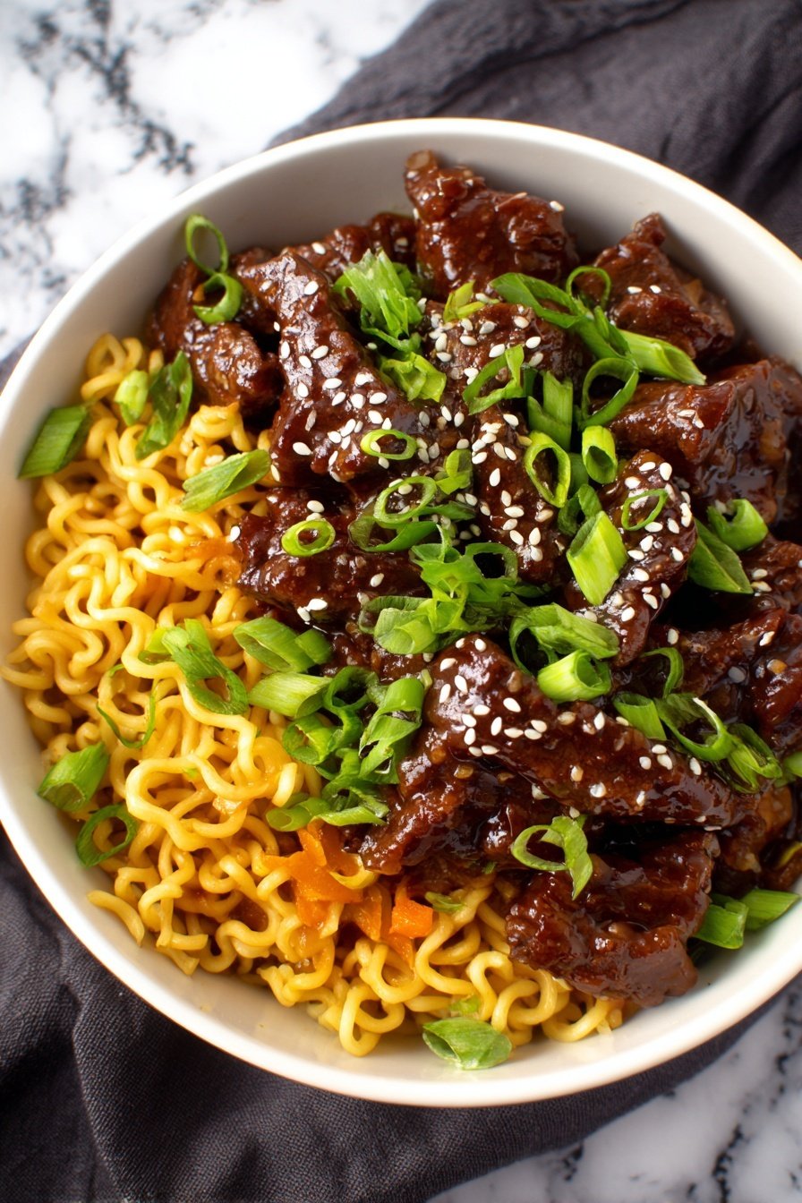 The image shows a white bowl filled with three main layers. The bottom layer has curly, yellow noodles that look soft and cooked. Above the noodles, there are small pieces of orange vegetables mixed in. The top layer is a generous amount of dark brown meat slices coated in a shiny sauce. The meat is garnished with chopped bright green onions and a sprinkle of white sesame seeds. The bowl sits on a dark cloth over a white marbled surface. Photo taken with an iphone --ar 2:3 --v 7 — Slow Cooker Korean Beef Noodles, Korean Beef Noodle Recipe, Easy Korean Beef Dish, Crockpot Korean Beef, Flavorful Asian Noodles