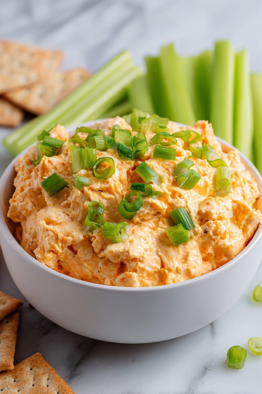 Buffalo Chicken Dip Recipe - Article Image 2 — Buffalo Chicken Dip, spicy buffalo chicken dip, creamy chicken appetizer, game day dip, easy party dip