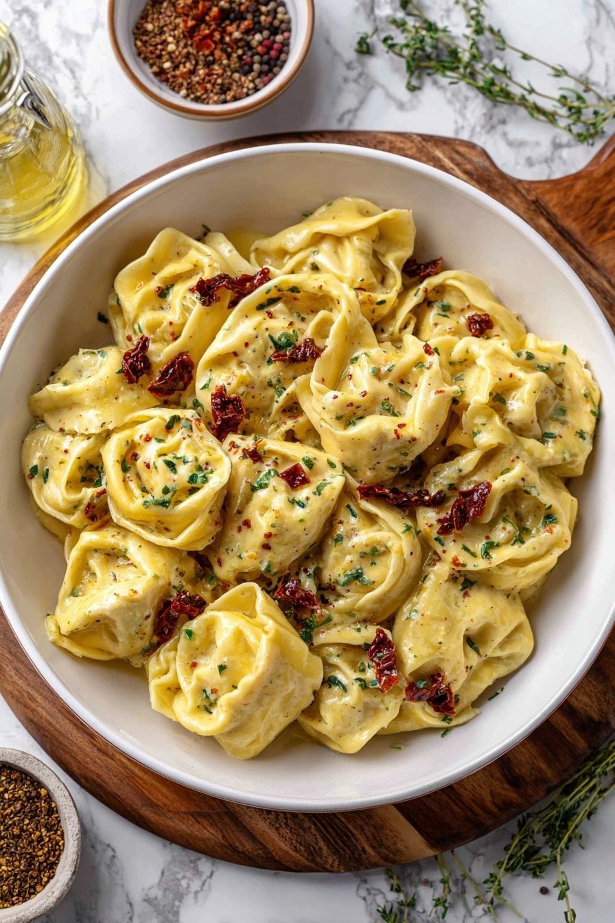Creamy Spicy Garlic Chicken Tortellini Recipe - Article Image 1 — Creamy Spicy Garlic Chicken Tortellini, spicy garlic chicken pasta, easy cheesy tortellini recipe, weeknight Italian dinner, comforting creamy pasta