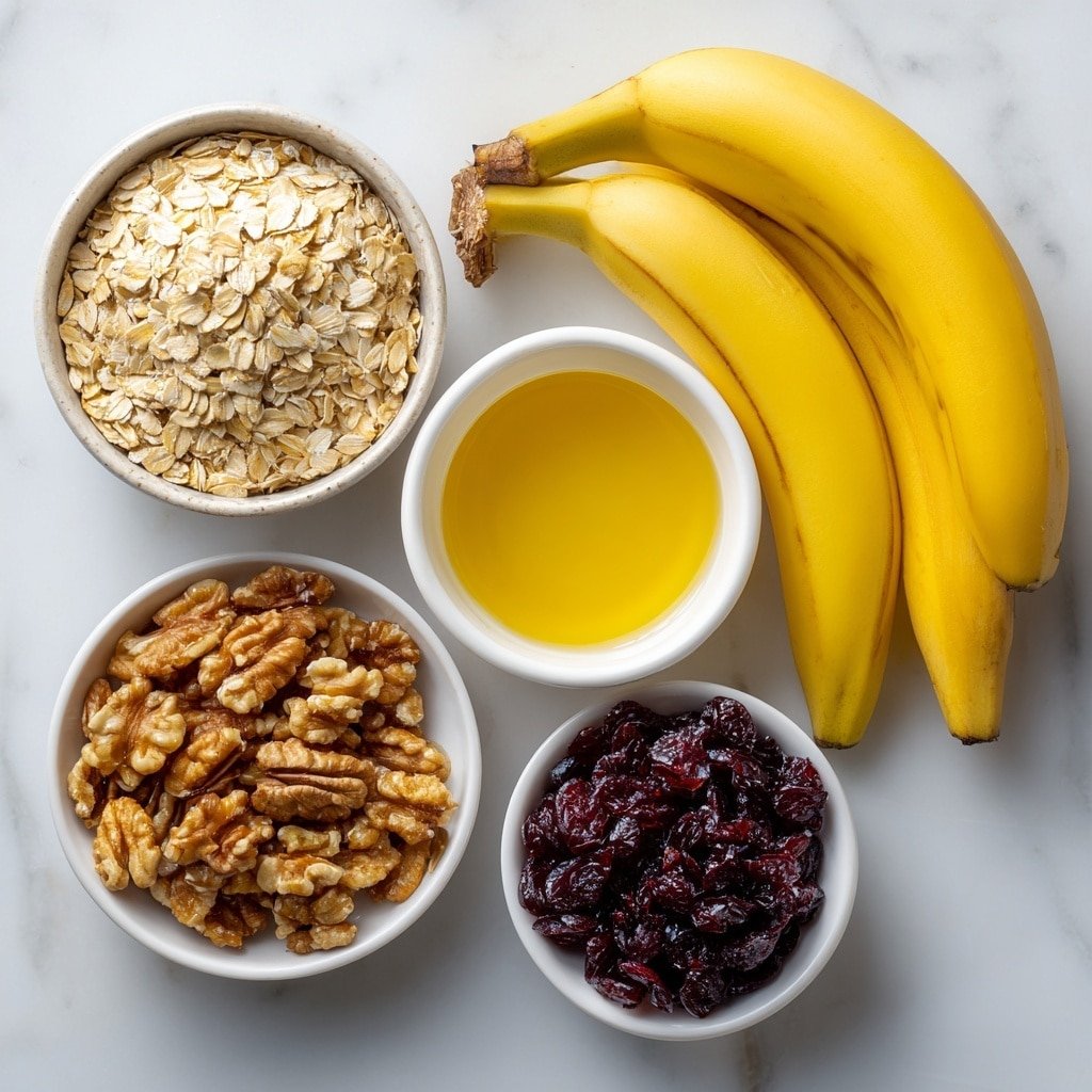 Flat lay of a small heap of old-fashioned rolled oats scattered neatly, three ripe bananas with bright yellow skins and slight brown speckles, a small white ceramic bowl filled with golden honey glistening under natural light, another small white bowl holding clear vegetable oil, a third small white bowl containing smooth vanilla extract, a small pile of warm brown ground cinnamon powder, a tiny mound of fine white salt, a neat cluster of chopped walnuts showcasing their natural texture and creamy brown color, and a small white bowl filled with deep red dried cranberries, all arranged symmetrically on a clean white marble surface, soft natural light, photo taken with an iPhone, professional food photography style, fresh ingredients, white ceramic bowls, no bottles, no duplicates, no utensils, no packaging --ar 1:1 --v 7 --p m7354639359234015250 — Banana Oatmeal Bars Healthy Snacks, wholesome banana oat bars recipe, easy homemade snack bars, nutritious banana oat bars, family-friendly healthy treats