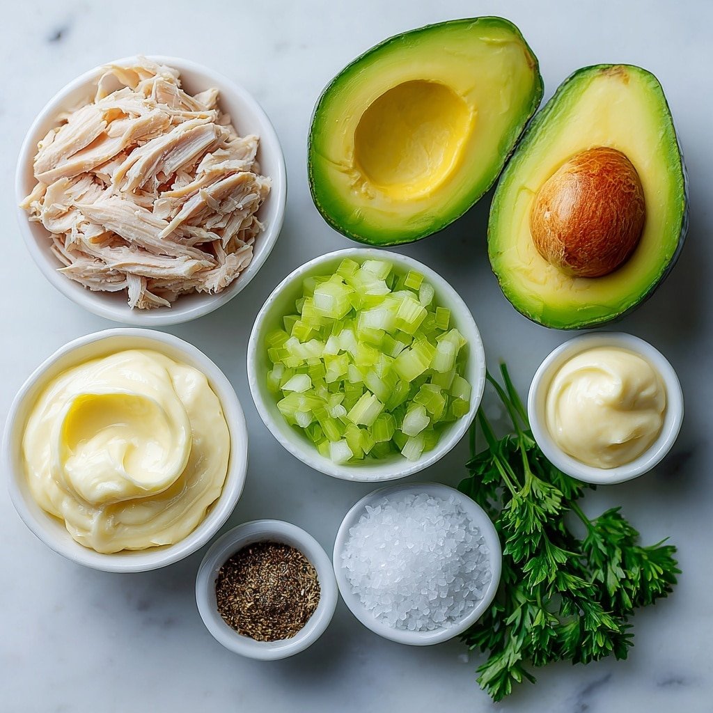 Flat lay of two ripe halved avocados with vibrant green flesh, a small white bowl of shredded cooked chicken, a small white bowl of creamy paleo mayo, a small white bowl of spicy brown mustard, a small white bowl with finely diced red onion, a small white bowl with diced celery, a small pile of fresh parsley sprigs, a small white bowl with coarse salt crystals, and a small white bowl with ground black pepper, all arranged symmetrically and balanced in realistic proportions, placed on a clean white marble surface, soft natural light, photo taken with an iPhone, professional food photography style, fresh ingredients, white ceramic bowls, no bottles, no duplicates, no utensils, no packaging --ar 1:1 --v 7 --p m7354639359234015250 — Chicken Salad Stuffed Avocado, healthy avocado chicken salad, easy stuffed avocado recipe, nutritious lunch ideas, quick chicken salad recipes