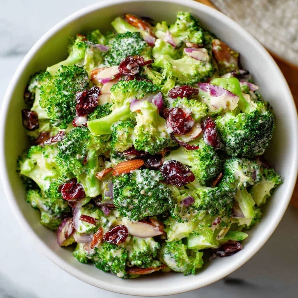 Delicious Broccoli Salad with Bacon and Cranberries Recipe - Article Image 2 — Broccoli Salad with Bacon and Cranberries, easy broccoli salad recipe, healthy broccoli salad, crunchy bacon broccoli salad, festive broccoli salad ideas
